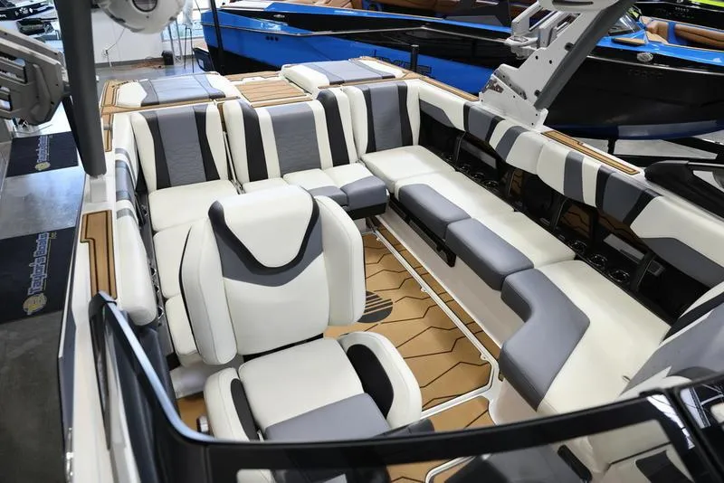 Slide: The Image of 2024 Malibu 23 MXZ boat interior with luxurious seating and modern design. - 20