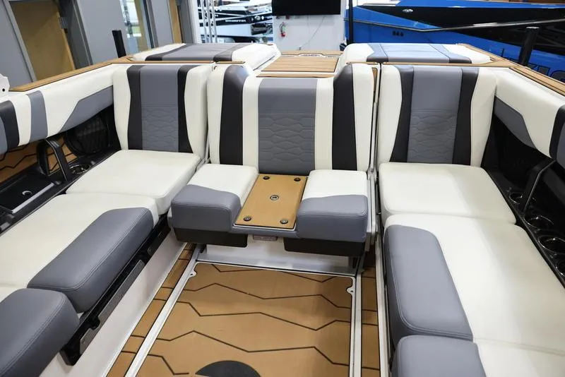 Slide: The Image of 2024 Malibu 23 MXZ boat interior with luxurious seating and modern design. - 21