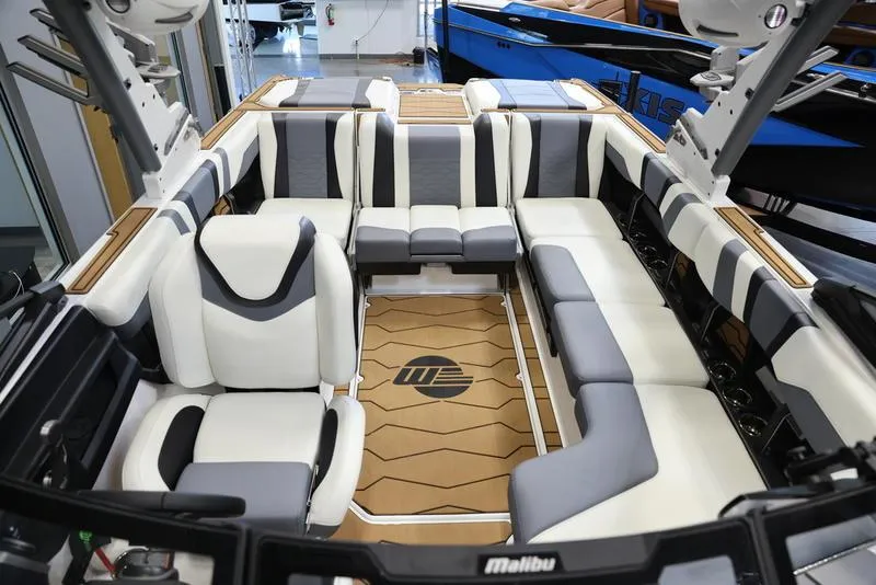 Slide: The Image of 2024 Malibu 23 MXZ boat interior with luxurious seating and modern design. - 23