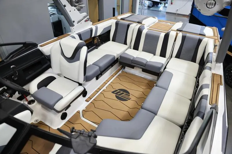 Slide: The Image of 2024 Malibu 23 MXZ boat interior with luxurious seating and modern design. - 24