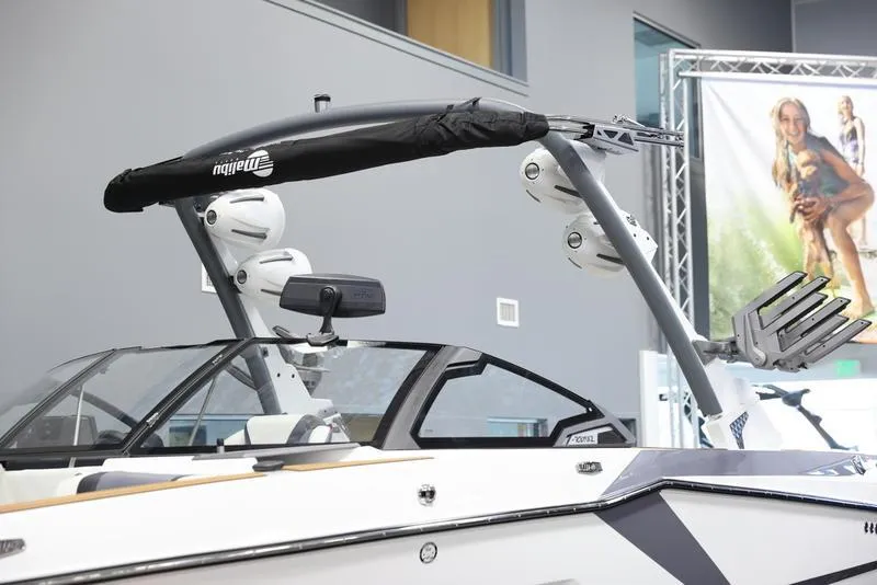 Slide: The Image of 2024 Malibu 23 MXZ boat with wakeboard tower and speakers. - 5
