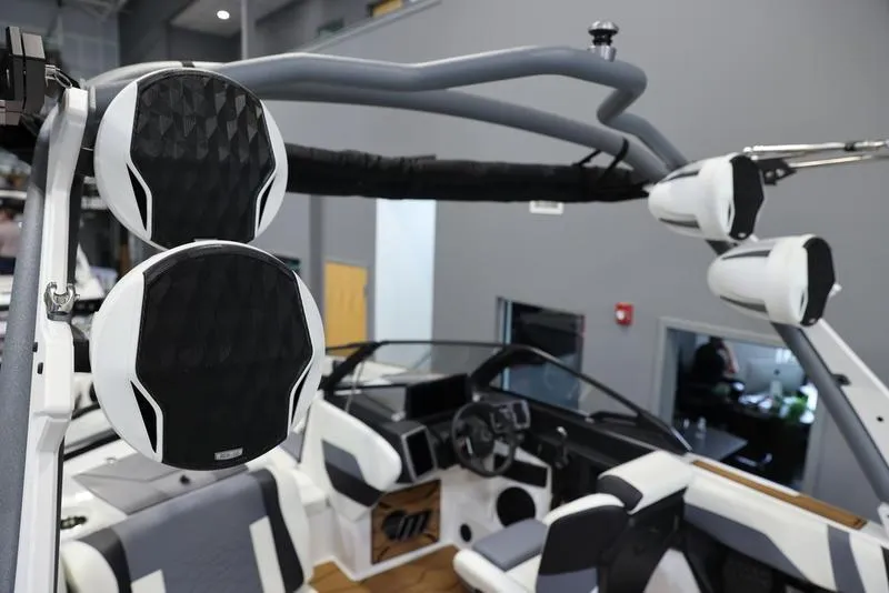 Slide: The Image of 2024 Malibu 23 MXZ boat interior with advanced sound system and modern design. - 6
