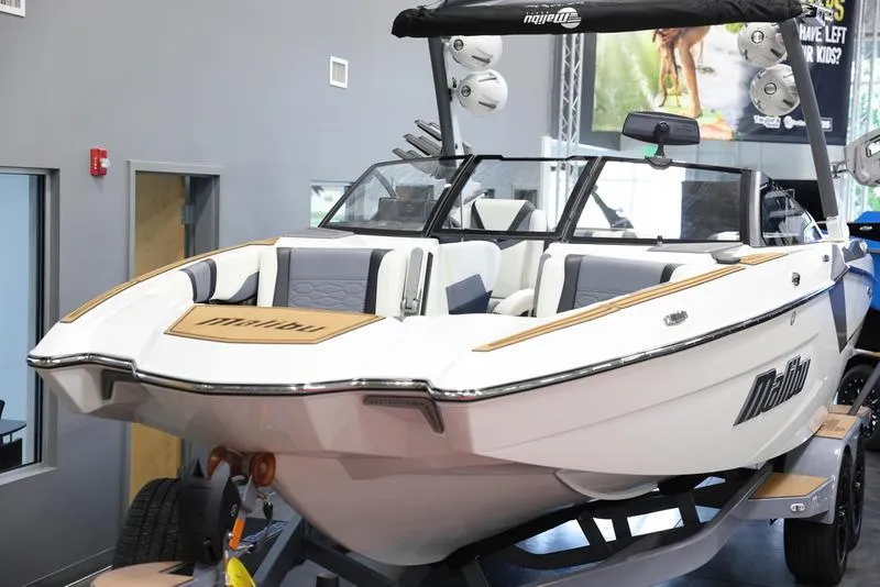 Slide: The Image of 2024 Malibu 23 MXZ boat on display in showroom. - 7
