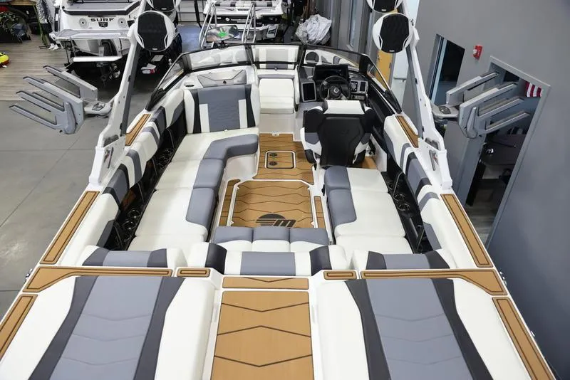 Slide: The Image of 2024 Malibu 23 MXZ boat interior with spacious seating and modern design. - 8