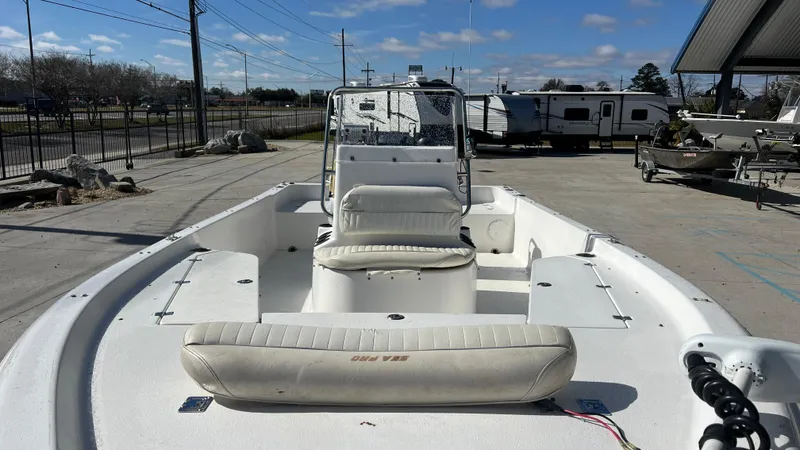Slide: The Image of 2005 Sea Pro SV2100 CC center console boat in a parking lot. - 11
