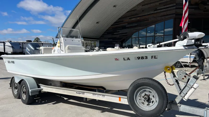 Slide: The Image of 2005 Sea Pro SV2100 CC boat on a trailer in front of a building. - 14
