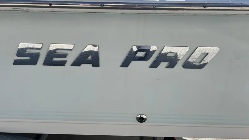 Slide: The Image of 2005 Sea Pro SV2100 CC boat side view with logo - 9