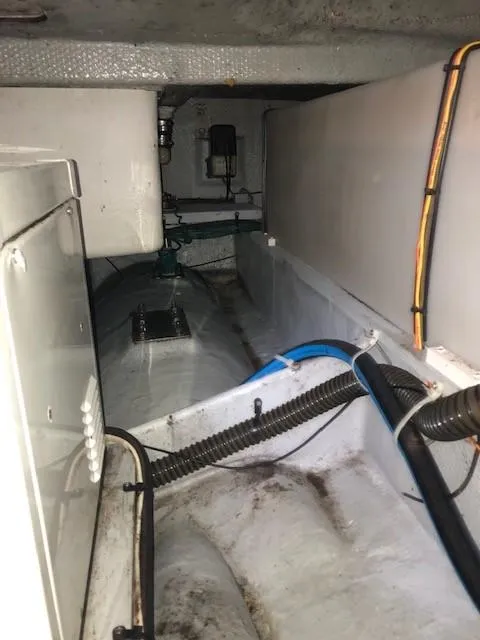 Slide: The Image of Engine compartment of a 2004 Silverton 34C boat, showing wiring and components. - 11