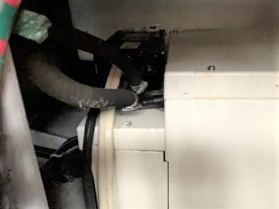 Slide: The Image of Engine compartment of a 2004 Silverton 34C boat, showing hoses and mechanical components. - 13