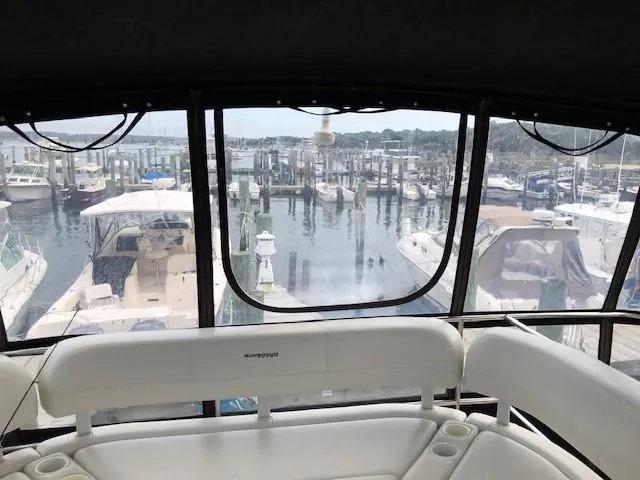 Slide: The Image of View from 2004 Silverton 34C yacht cockpit overlooking marina with multiple boats docked. - 19