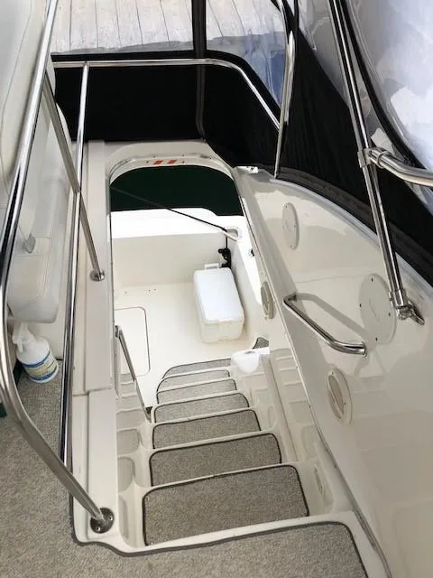 Slide: The Image of Staircase on 2004 Silverton 34C yacht, featuring sleek design and modern amenities. - 21