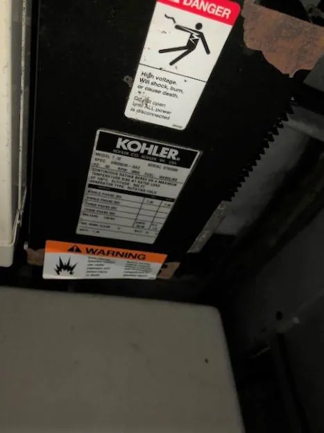 Slide: The Image of Kohler generator warning labels on a 2004 Silverton 34C boat. - 3