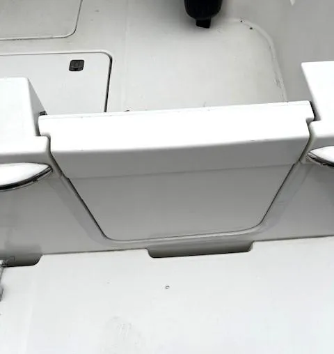 Slide: The Image of 2004 Silverton 34C boat deck with white seating and storage compartments. - 39