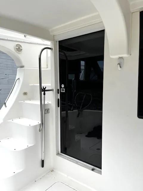 Slide: The Image of 2004 Silverton 34C yacht interior with stairs and sliding glass door. - 41