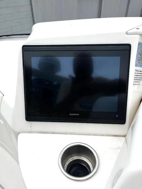 Slide: The Image of Garmin display on 2004 Silverton 34C boat dashboard with cup holder. - 45