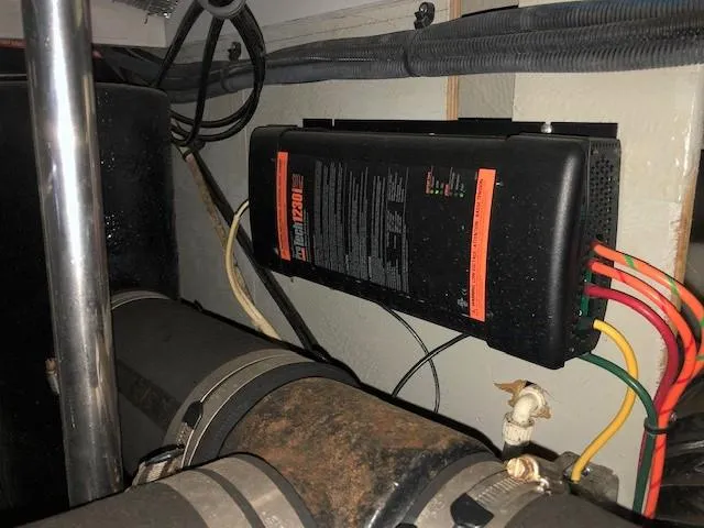 Slide: The Image of Engine compartment of a 2004 Silverton 34C boat with electrical components and wiring. - 5