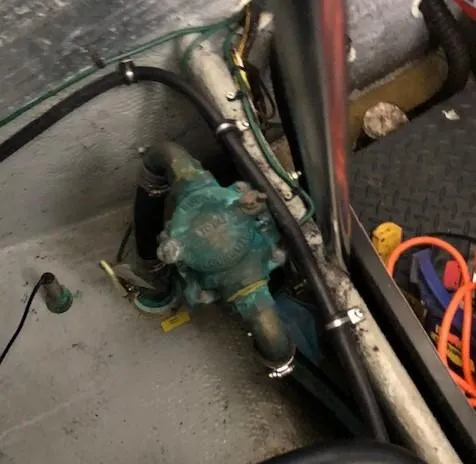 Slide: The Image of Engine compartment of a 2004 Silverton 34C boat, showing mechanical components and wiring. - 7