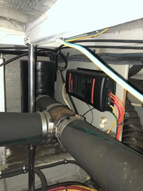 Slide: The Image of Engine room wiring and pipes in a 2004 Silverton 34C boat. - 9