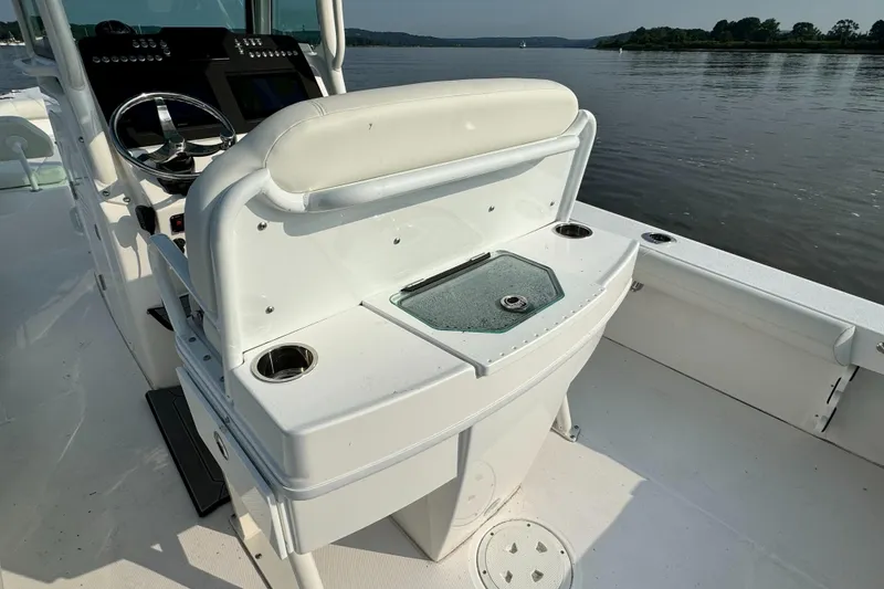 Slide: The Image of 2024 Everglades 253 Center Console boat interior with helm and seating. - 13