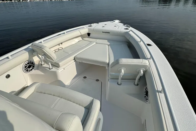 Slide: The Image of 2024 Everglades 253 Center Console boat interior with seating and storage. - 17