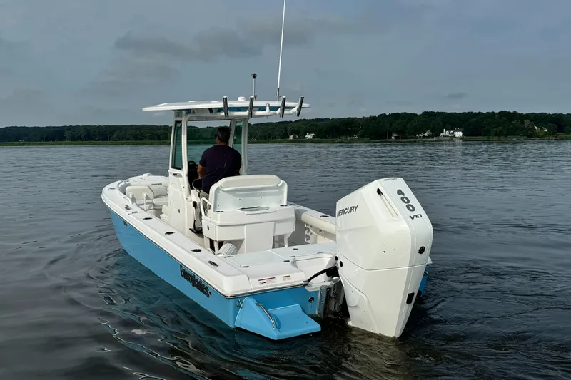 Slide: The Image of 2024 Everglades 253 Center Console boat on calm water. - 4
