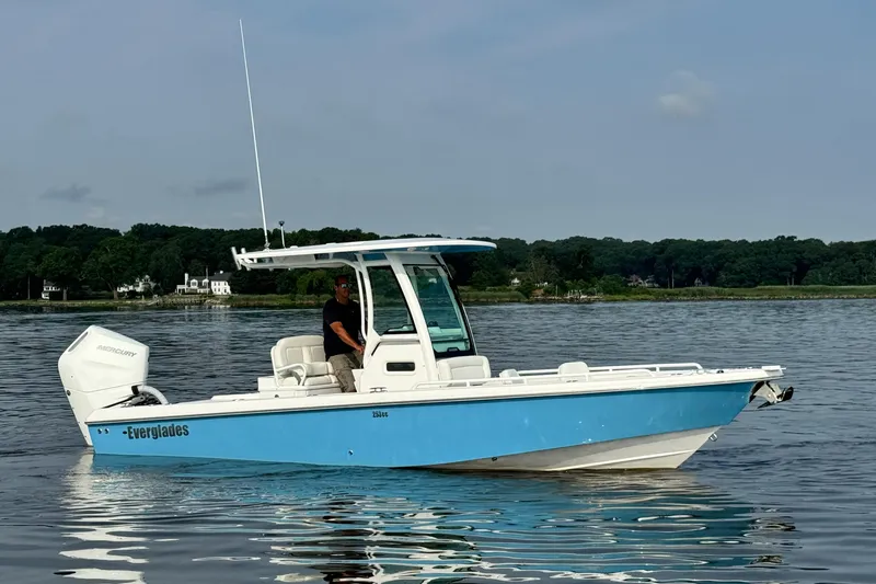 Slide: The Image of 2024 Everglades 253 Center Console boat on calm water. - 8