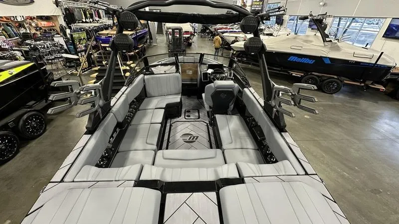 Slide: The Image of 2024 Malibu 22 LSV boat interior with spacious seating and modern design. - 4