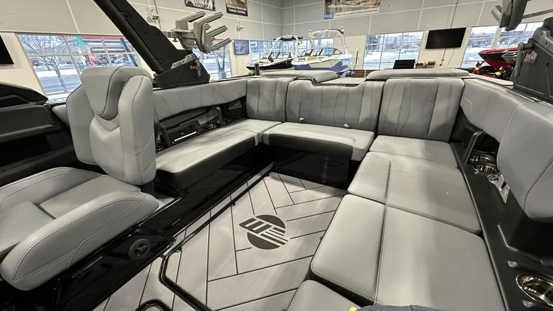 Slide: The Image of 2024 Malibu 22 LSV boat interior with luxurious gray seating and modern design. - 5