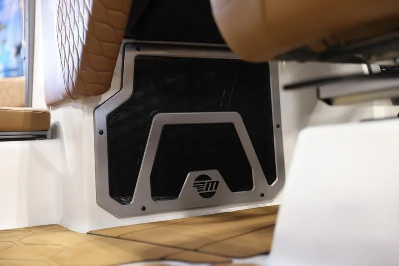 Slide: The Image of 2024 Malibu M220 boat interior with premium seating and speaker system. - 16