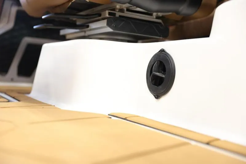 Slide: The Image of Close-up of the interior of a 2024 Malibu M220 boat showing a vent. - 17