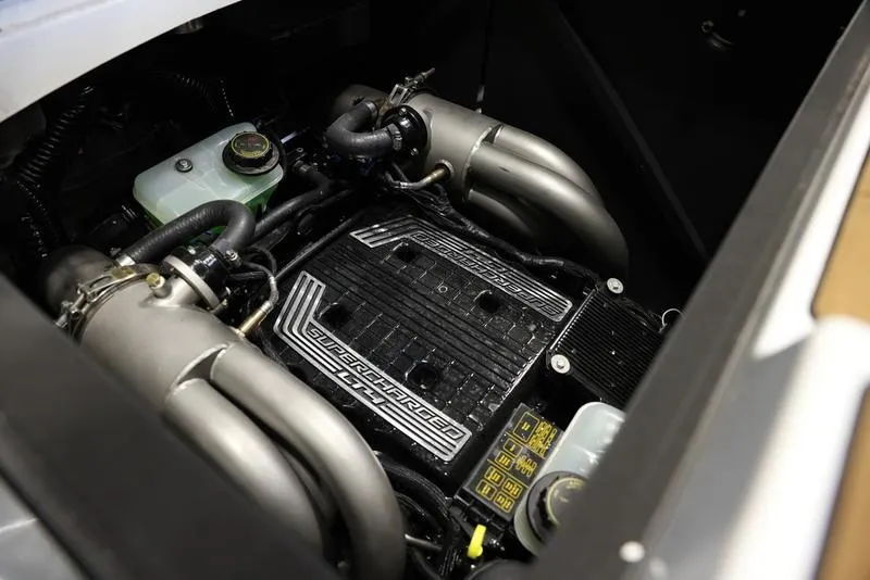 Slide: The Image of 2024 Malibu M220 engine compartment showcasing supercharged power unit. - 2