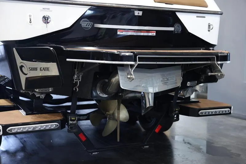 Slide: The Image of 2024 Malibu M220 boat stern with propeller and Surf Gate system. - 5