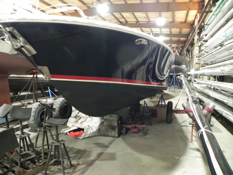 Slide: The Image of 2015 Chris-Craft 28 Heritage Corsair in storage, showcasing sleek design and craftsmanship. - 10