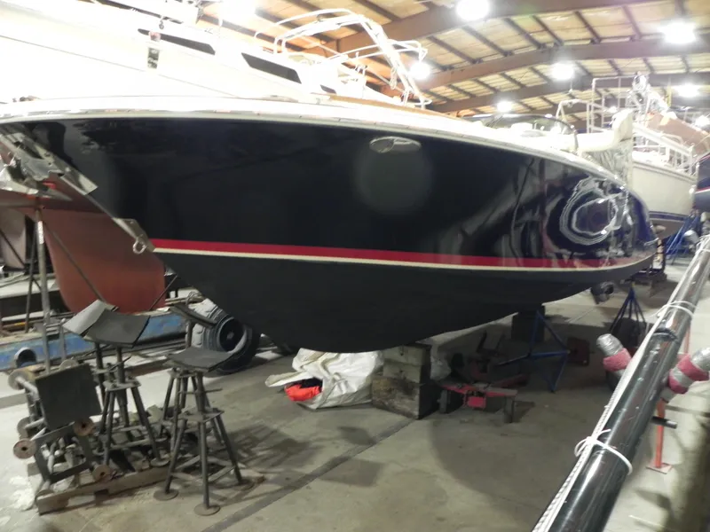 Slide: The Image of 2015 Chris-Craft 28 Heritage Corsair boat in a storage facility. - 11