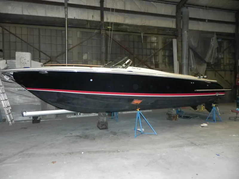 The Image of 2015 Chris-Craft 28 Heritage Corsair boat in a warehouse on stands. - 2