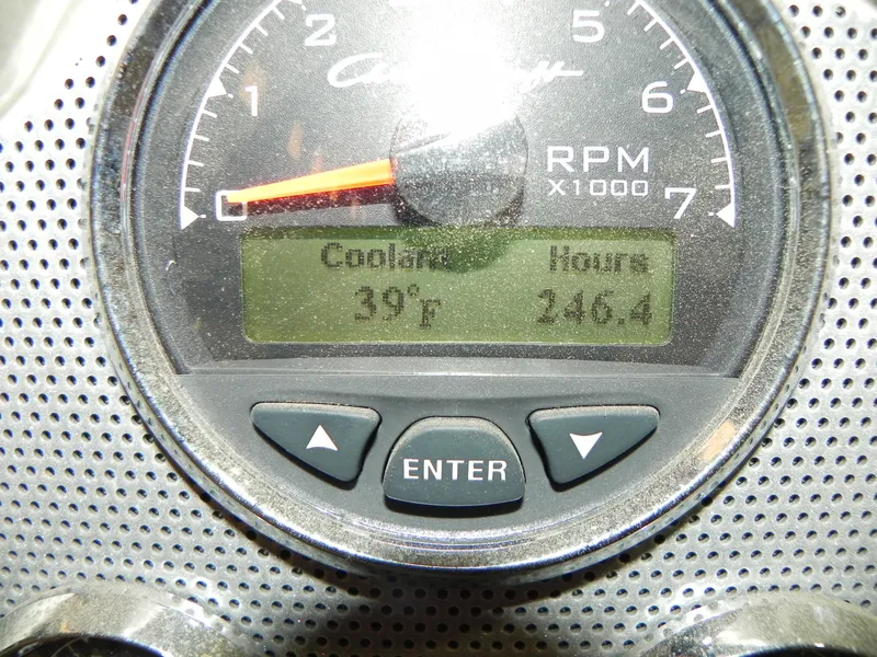 Slide: The Image of Close-up of a 2015 Chris-Craft 28 Heritage Corsair RPM gauge displaying coolant temperature and engine hours. - 23