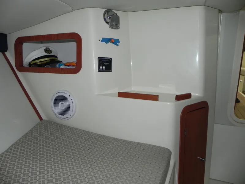 Slide: The Image of Interior cabin of 2015 Chris-Craft 28 Heritage Corsair with bed and storage. - 27