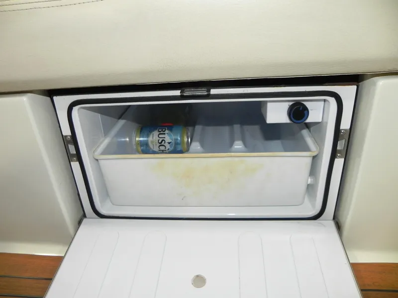 Slide: The Image of Built-in cooler on 2015 Chris-Craft 28 Heritage Corsair with a beverage can inside. - 31