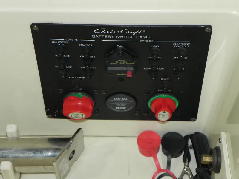 Slide: The Image of Battery switch panel of 2015 Chris-Craft 28 Heritage Corsair boat with controls and indicators. - 34