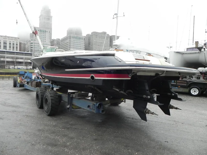 Slide: The Image of 2015 Chris-Craft 28 Heritage Corsair boat on trailer in urban marina setting. - 4
