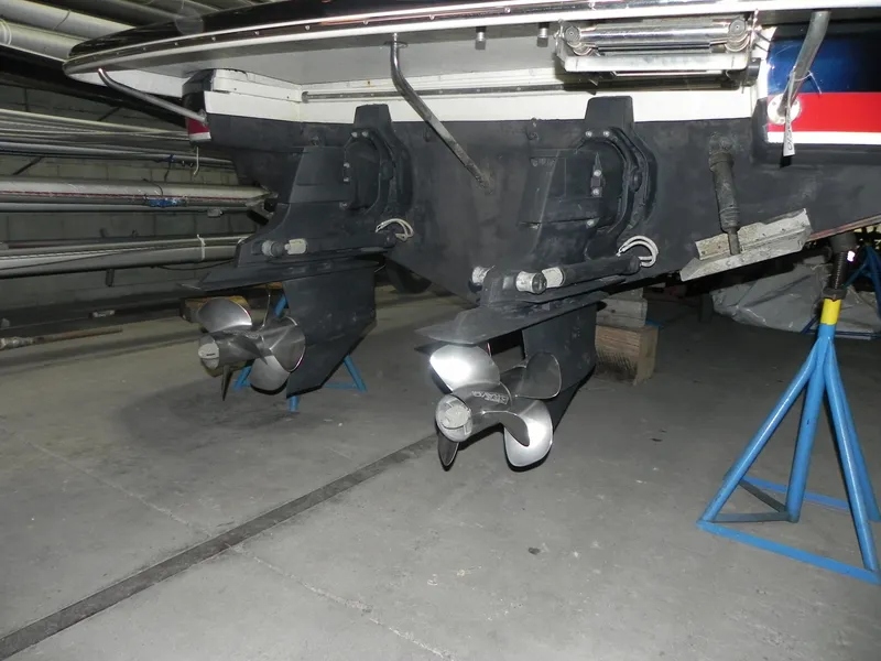 Slide: The Image of 2015 Chris-Craft 28 Heritage Corsair boat propellers in storage on stands. - 5