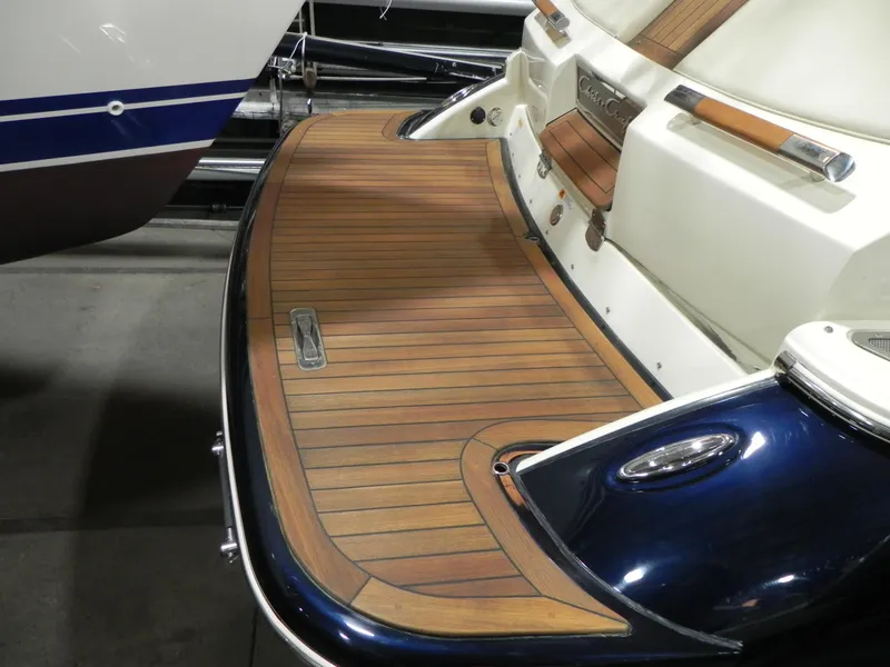 Slide: The Image of 2015 Chris-Craft 28 Heritage Corsair boat with elegant wooden deck detailing. - 6