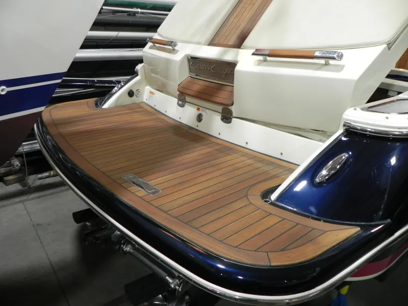 Slide: The Image of 2015 Chris-Craft 28 Heritage Corsair boat with teak swim platform and elegant design. - 7