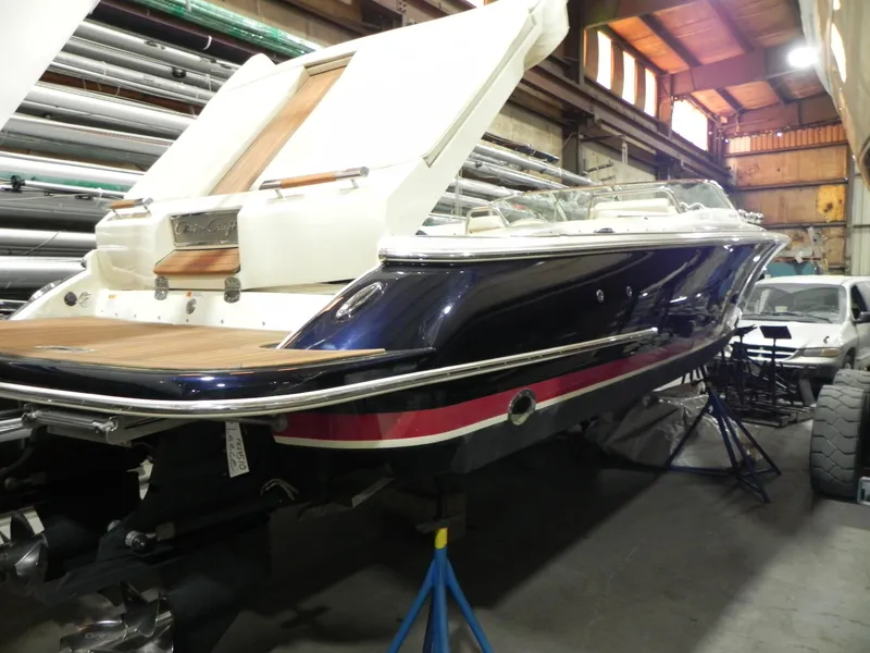 Slide: The Image of 2015 Chris-Craft 28 Heritage Corsair boat in a storage facility. - 8