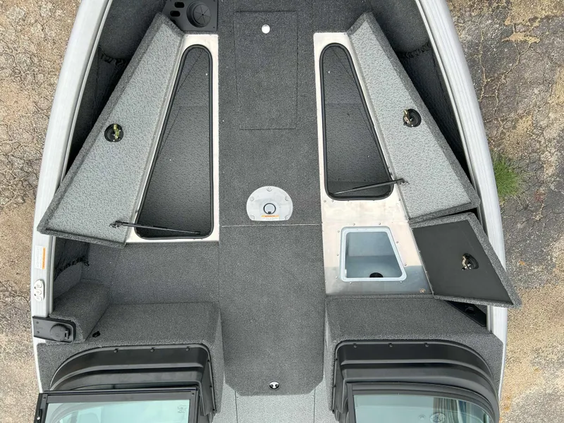 Slide: The Image of 2025 Lund 1875 Impact XS Fish boat interior with storage compartments and livewell. - 3