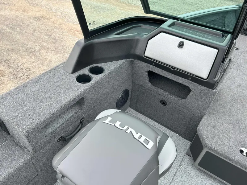 Slide: The Image of 2025 Lund 1875 Impact XS Fish boat interior with seating and storage compartments. - 6