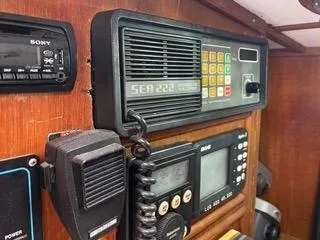 Slide: The Image of 1984 Tayana 55 yacht communication equipment, including SEA 222 radio and navigation instruments. - 25