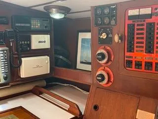 Slide: The Image of Navigation and control panel of a 1984 Tayana 55 sailboat with various instruments and gauges. - 37