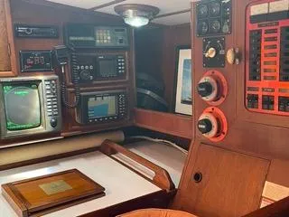 Slide: The Image of Navigation station of a 1984 Tayana 55 sailboat with electronic equipment. - 38