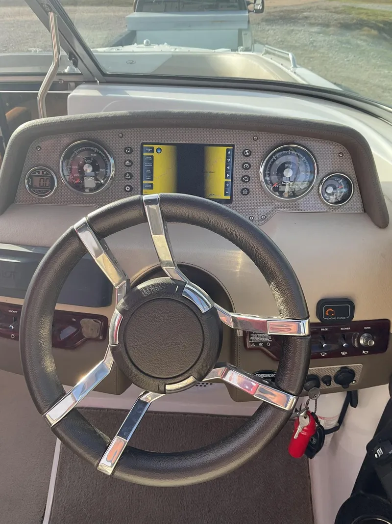 Slide: The Image of Steering wheel and dashboard of a 2013 Regal 27 FasDeck RX boat. - 14